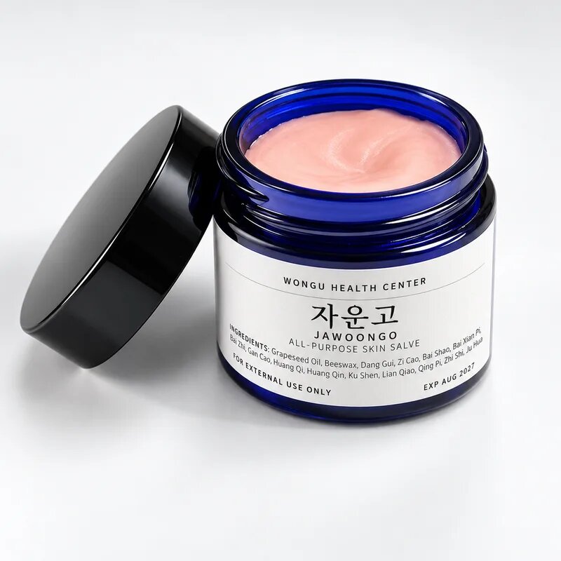 Open jar of Jawoongo showing the soft pink balm